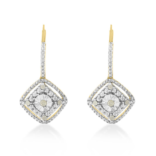 Front-facing shot of yellow metal earrings with a square-shaped design featuring round white gemstones in prong settings.