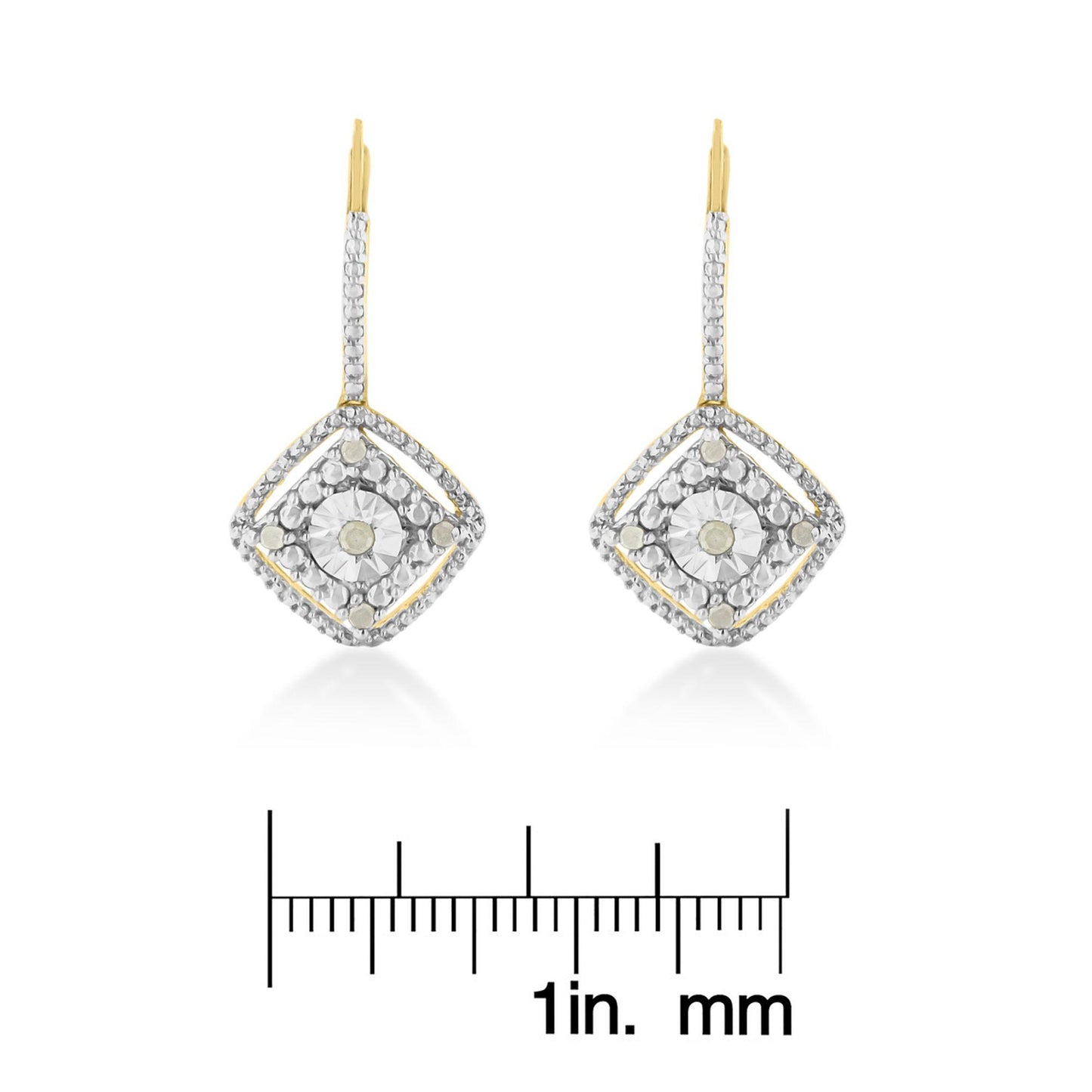 Pair of yellow metal earrings with white round prong-set gemstones arranged in a square design, shown from the front on a ruler for size reference.