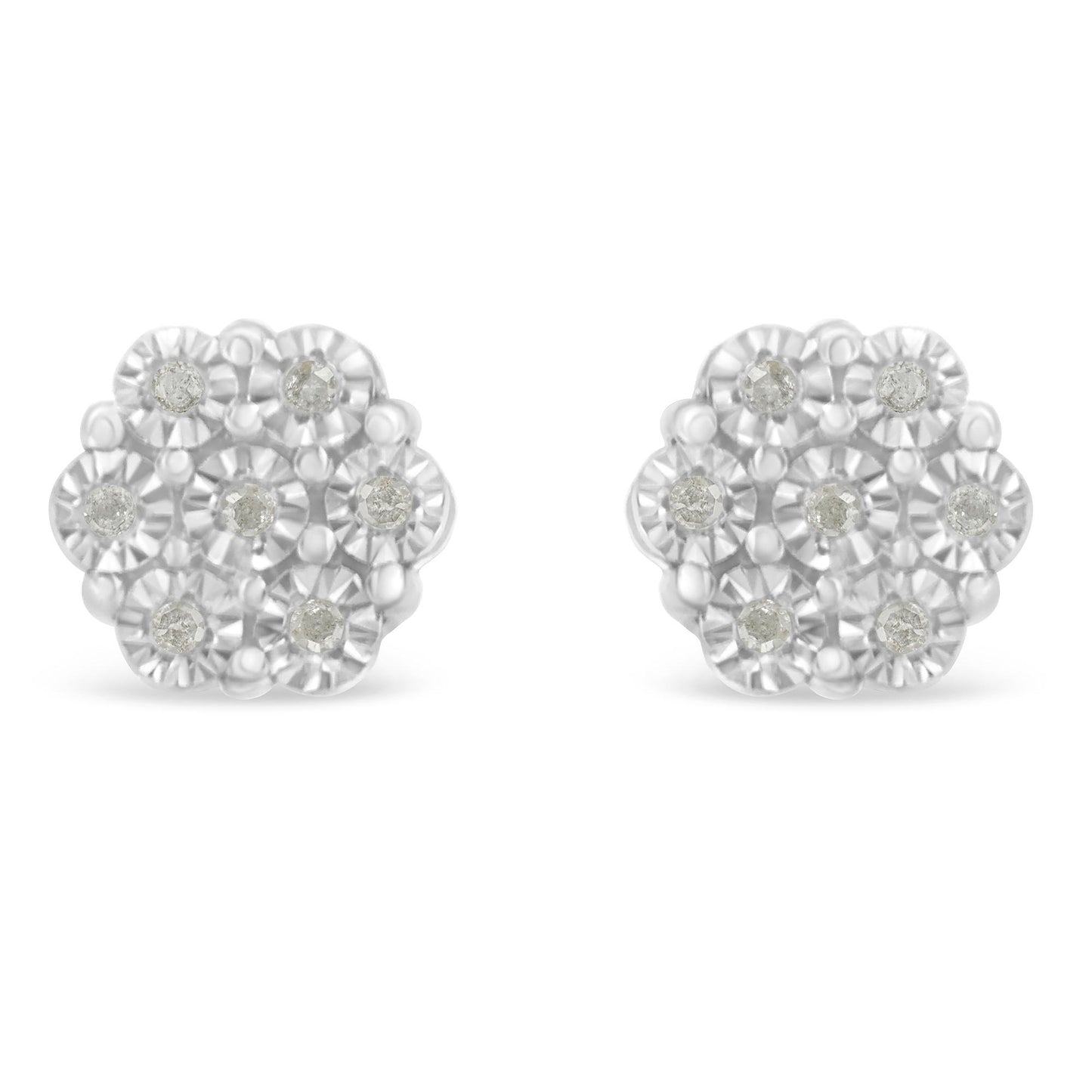 Front-angle view of a pair of white metal earrings shaped like flowers with multiple round white gemstones arranged in a miracle setting.