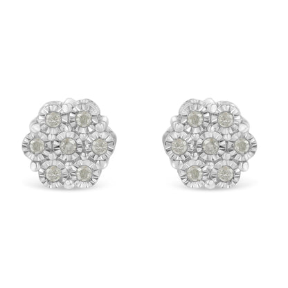 Front angle view of white metal circular earrings with cluster of round white gemstones in miracle setting.