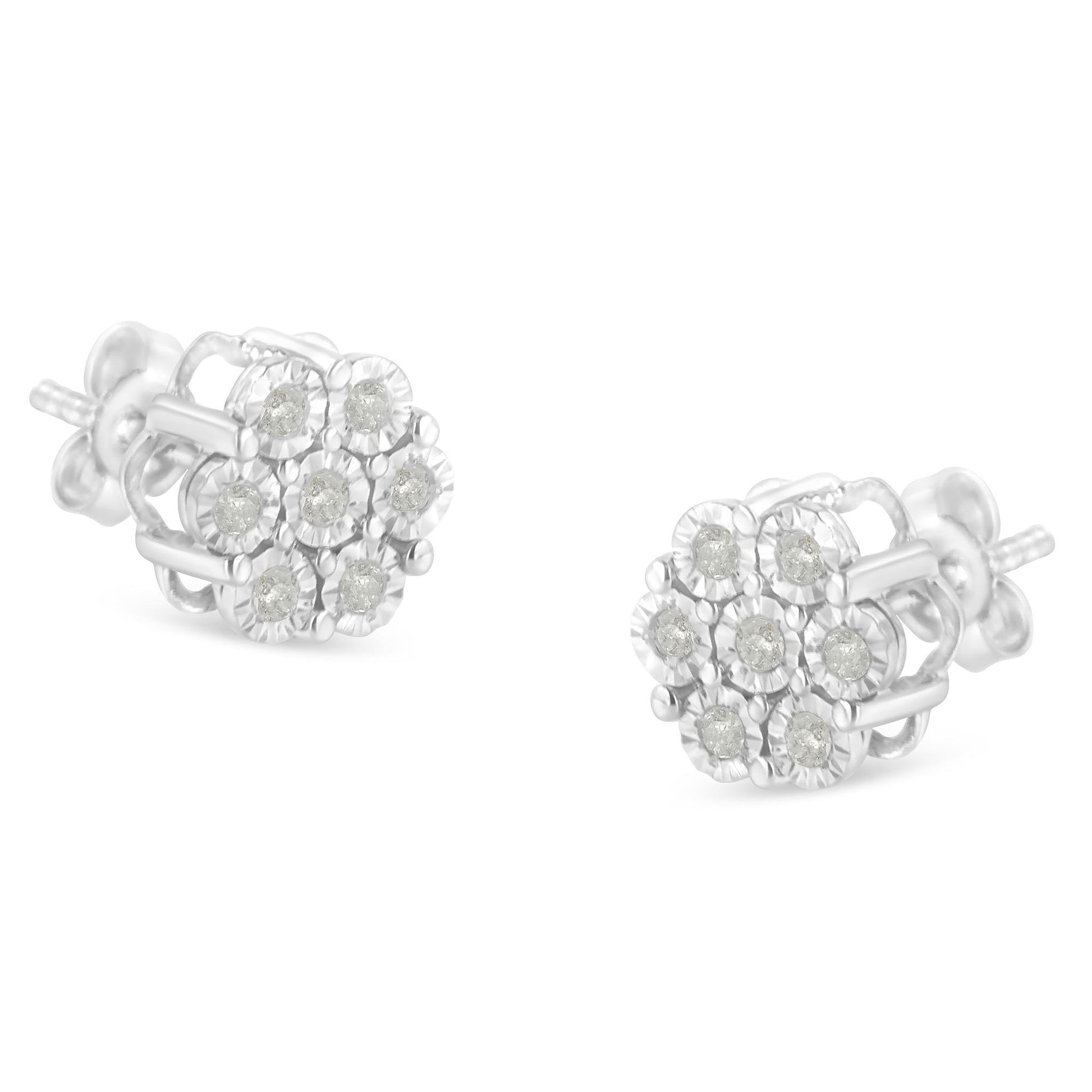 Pair of white metal stud earrings with round white gemstones in a floral cluster design, shown from a slightly angled front view.