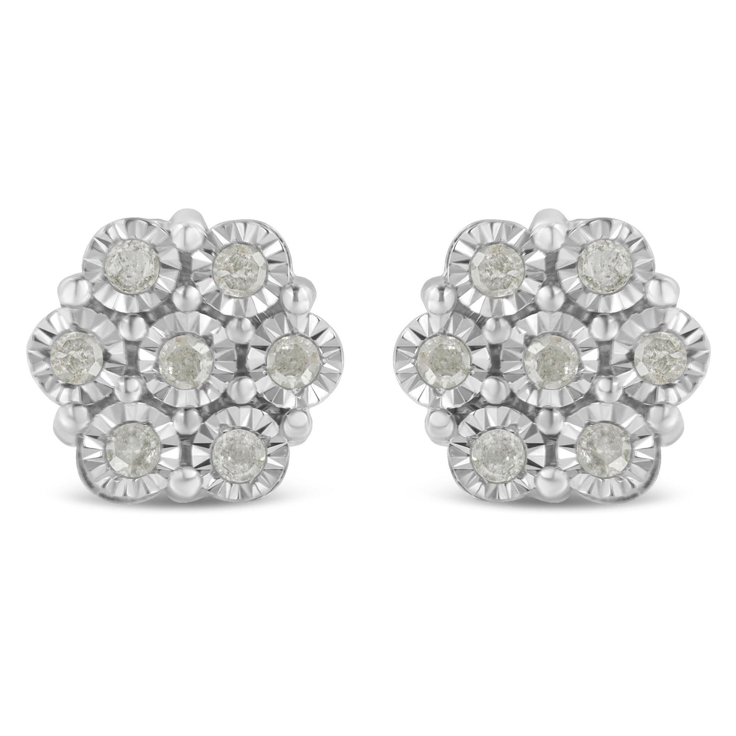 Front angle view of white metal earrings with round white gemstones arranged in a floral cluster design.