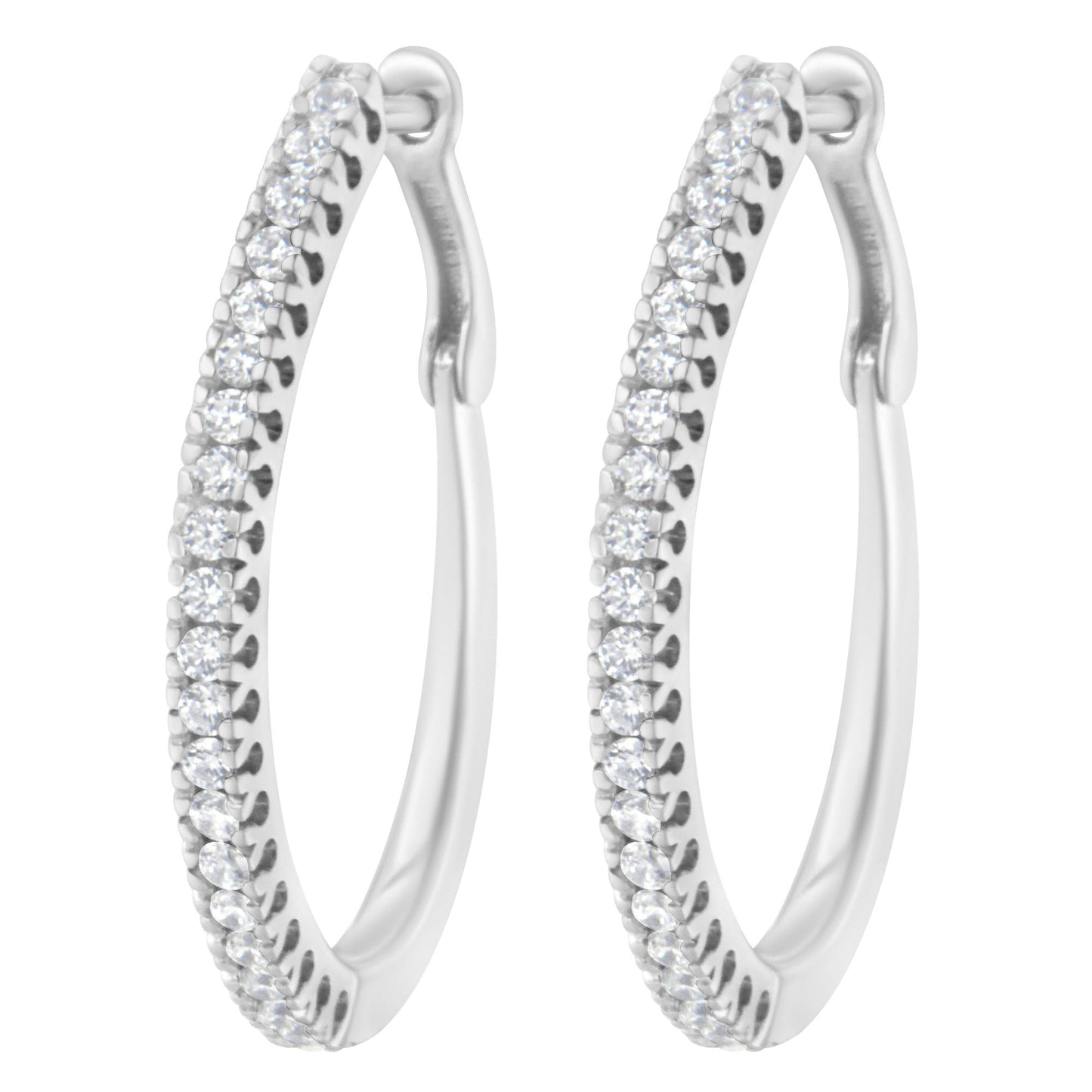 Close-up front view of a pair of white metal hoop earrings set with multiple round white gemstones in a prong setting along the front outer edge.
