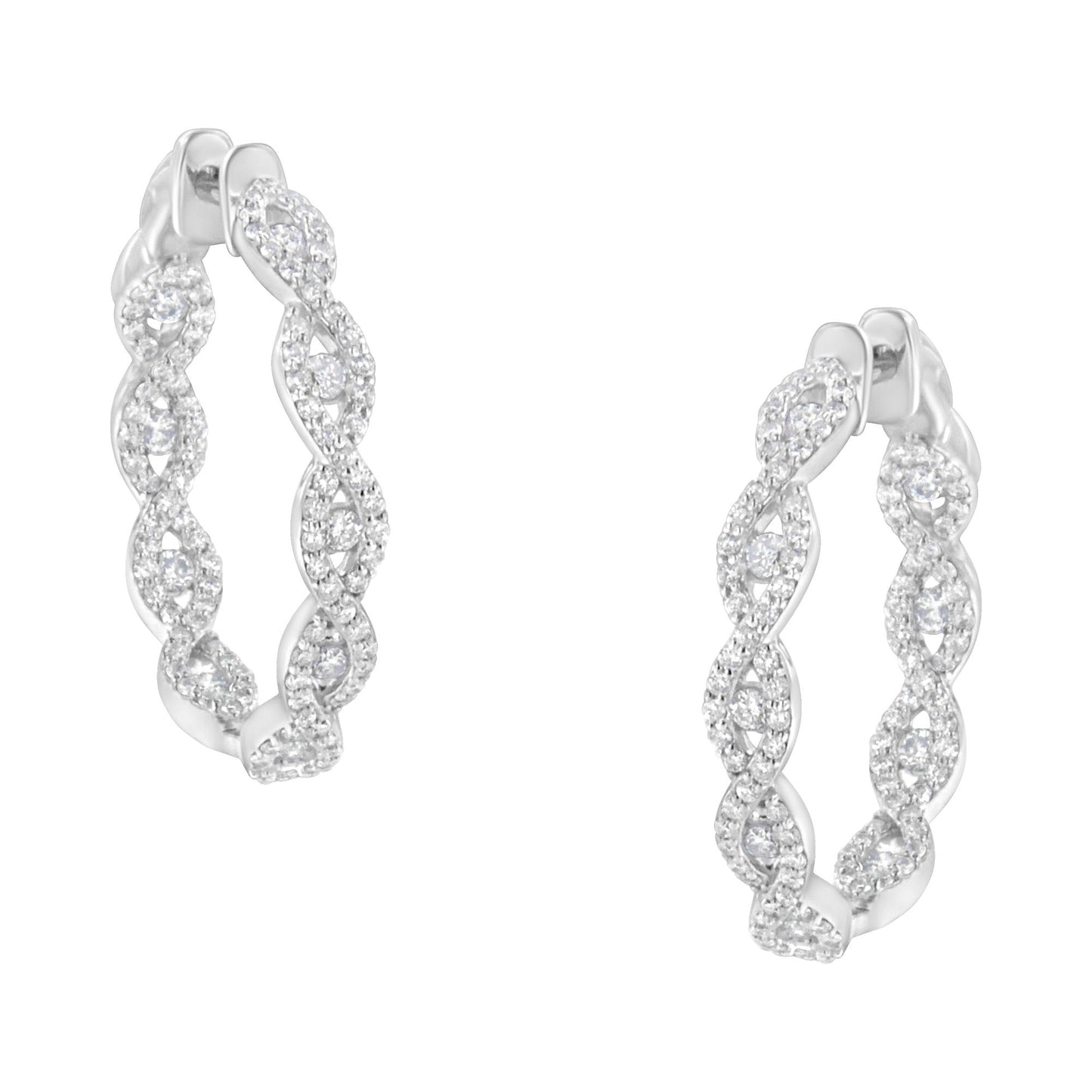 Front angle view of white metal hoop earrings with an intertwined twisted design, each encrusted with numerous small white gemstones in prong settings.