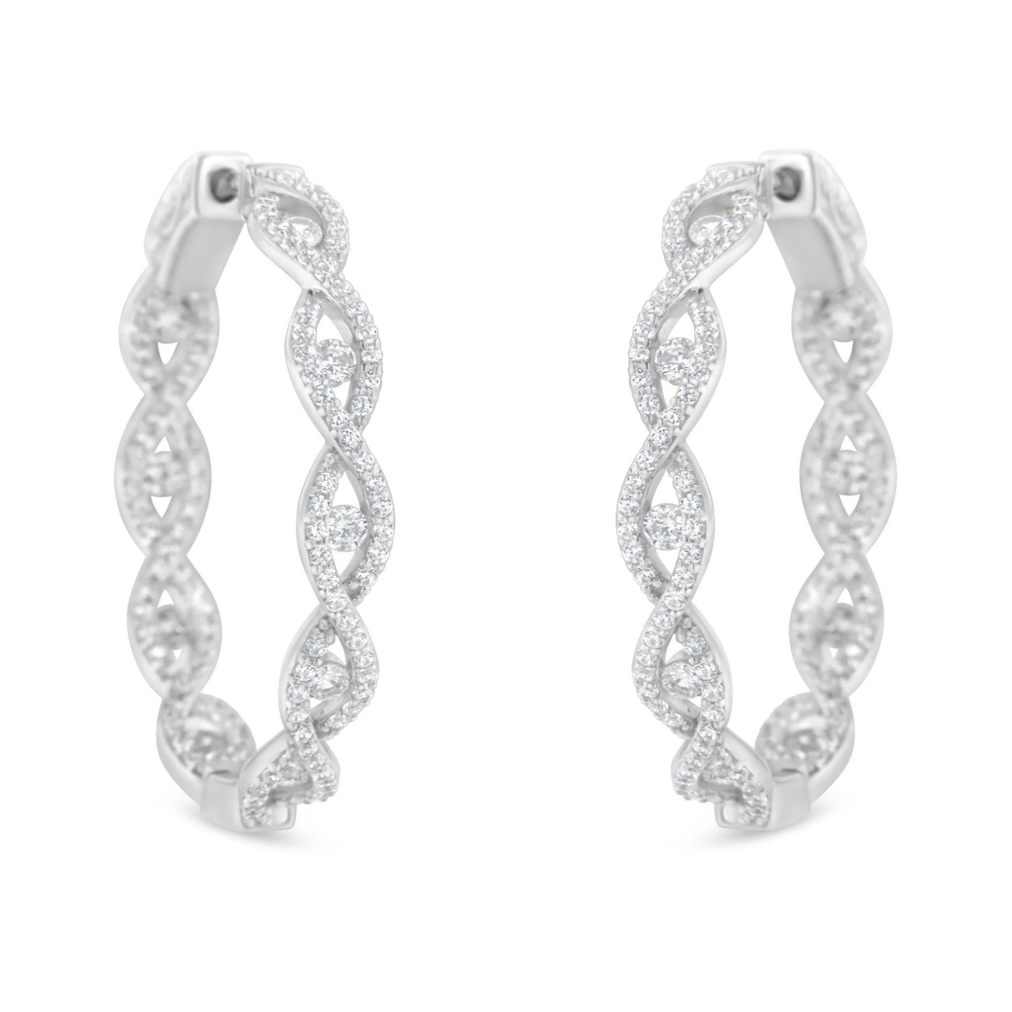 Front-facing close-up of white metal hoop earrings with intertwined design, adorned with multiple round white gemstones in prong settings.