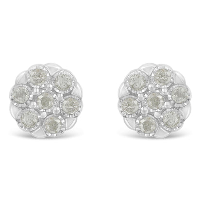 Front angle close-up of white metal round earrings featuring multiple white gemstones set in a circular cluster pattern.