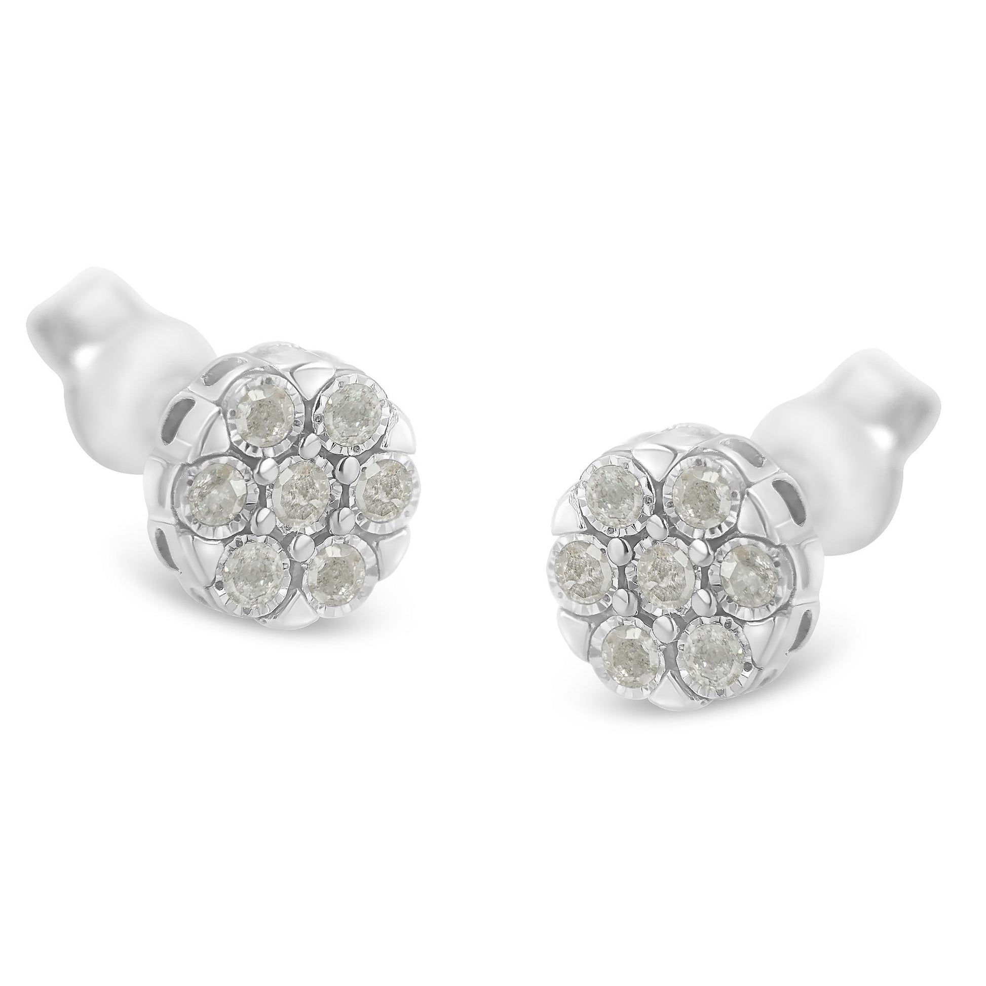 Pair of white metal stud earrings with round white gemstones arranged in a cluster with miracle setting, shown at a slight angled front view.