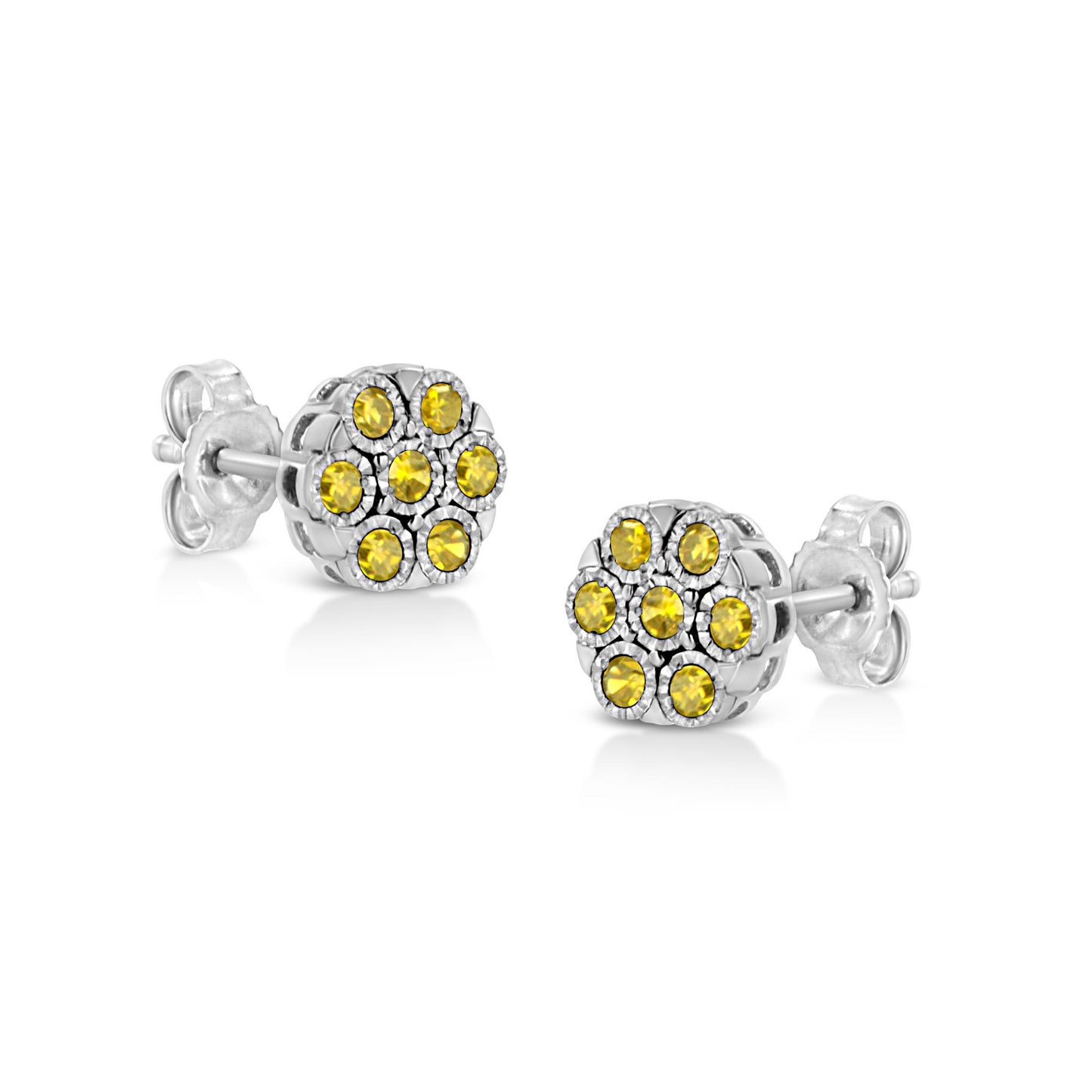 Pair of white metal stud earrings with round yellow gemstones set in a cluster miracle setting, shown from a front-side angle.