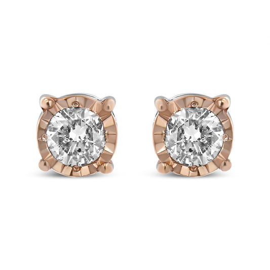 Front view of two-toned stud earrings with round white gemstones in miracle setting.