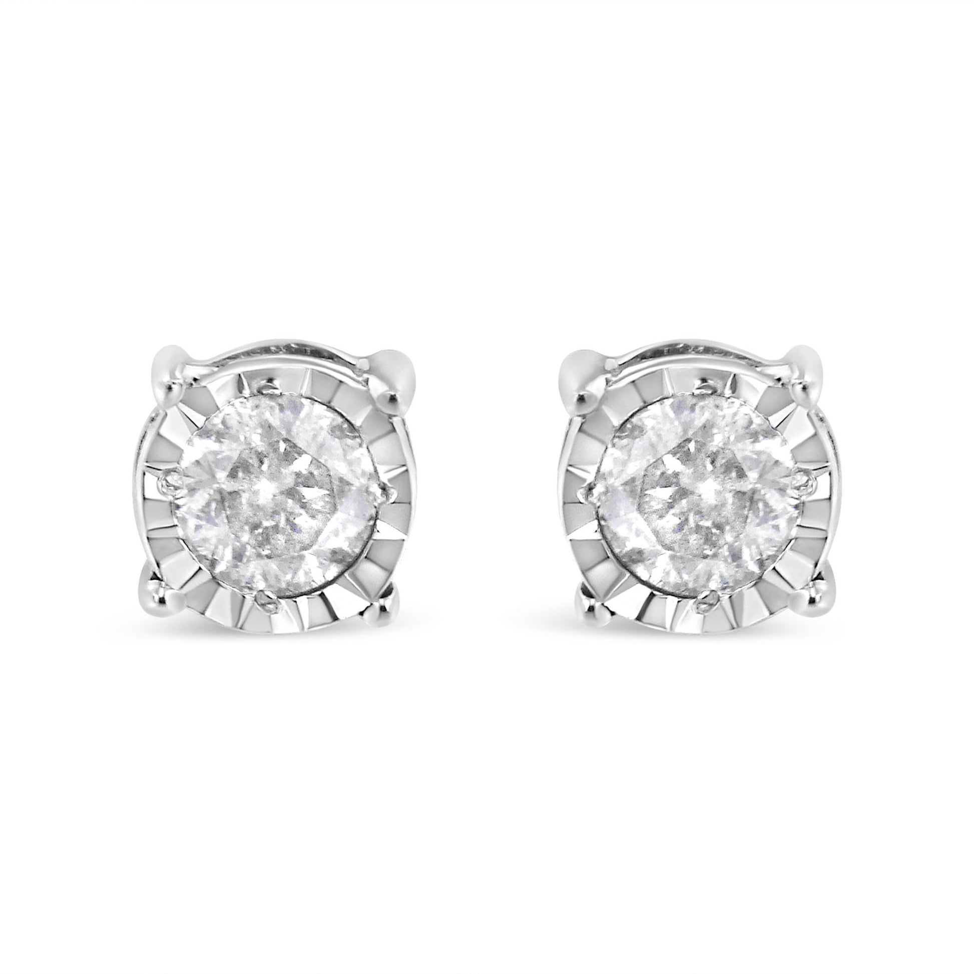 Pair of white metal stud earrings with round white gemstones in miracle settings, front facing angle.