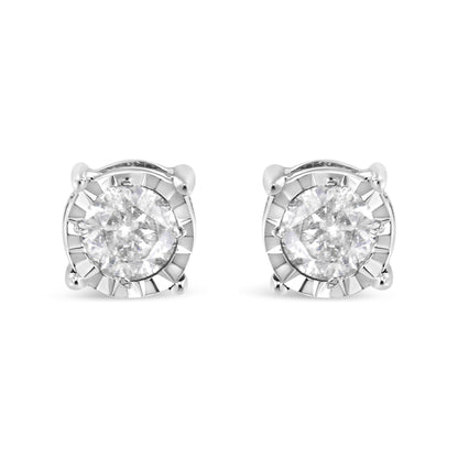 Pair of white metal stud earrings with round white gemstones in miracle settings, front facing angle.