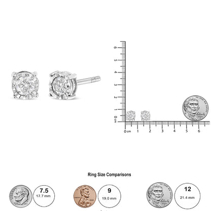 Close-up front and side view of white metal stud earrings with round shaped brownish gemstone in miracle setting, shown next to a ruler and coin for size reference.