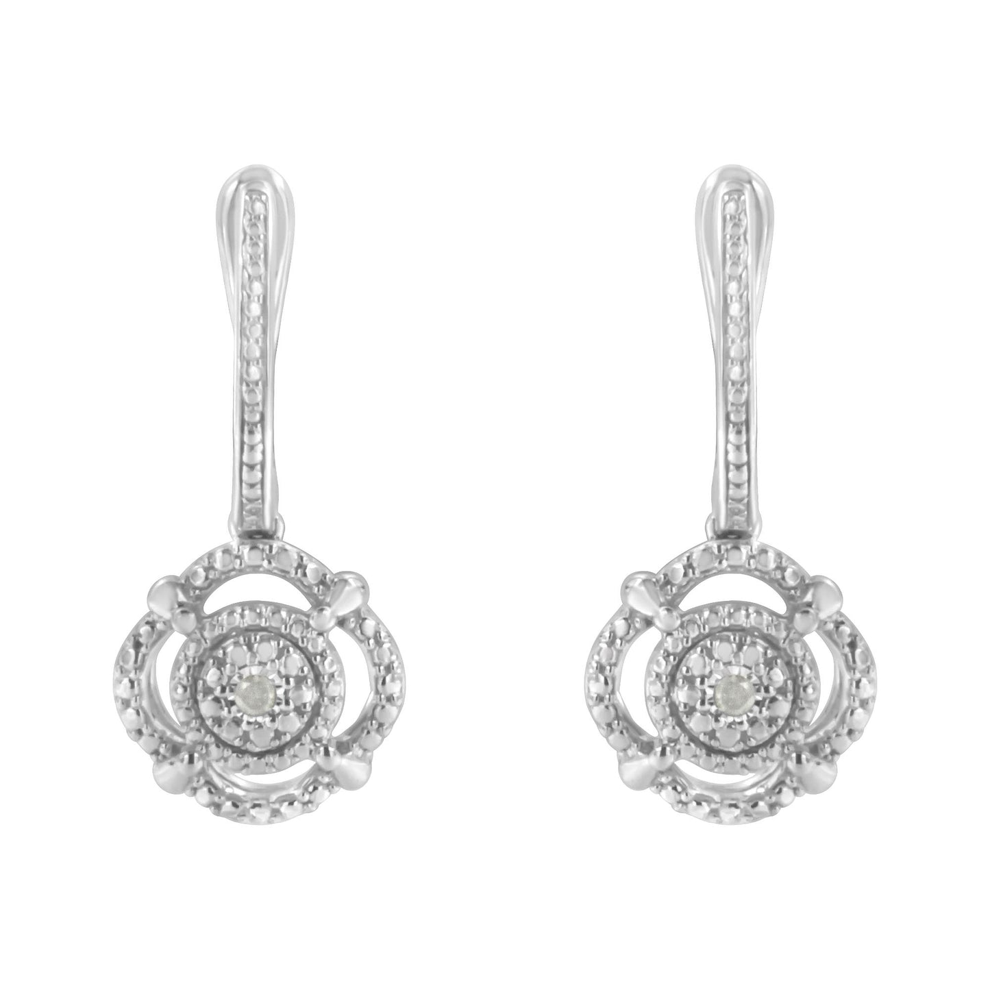 Front-facing view of white metal earrings with round white gemstones in miracle settings.