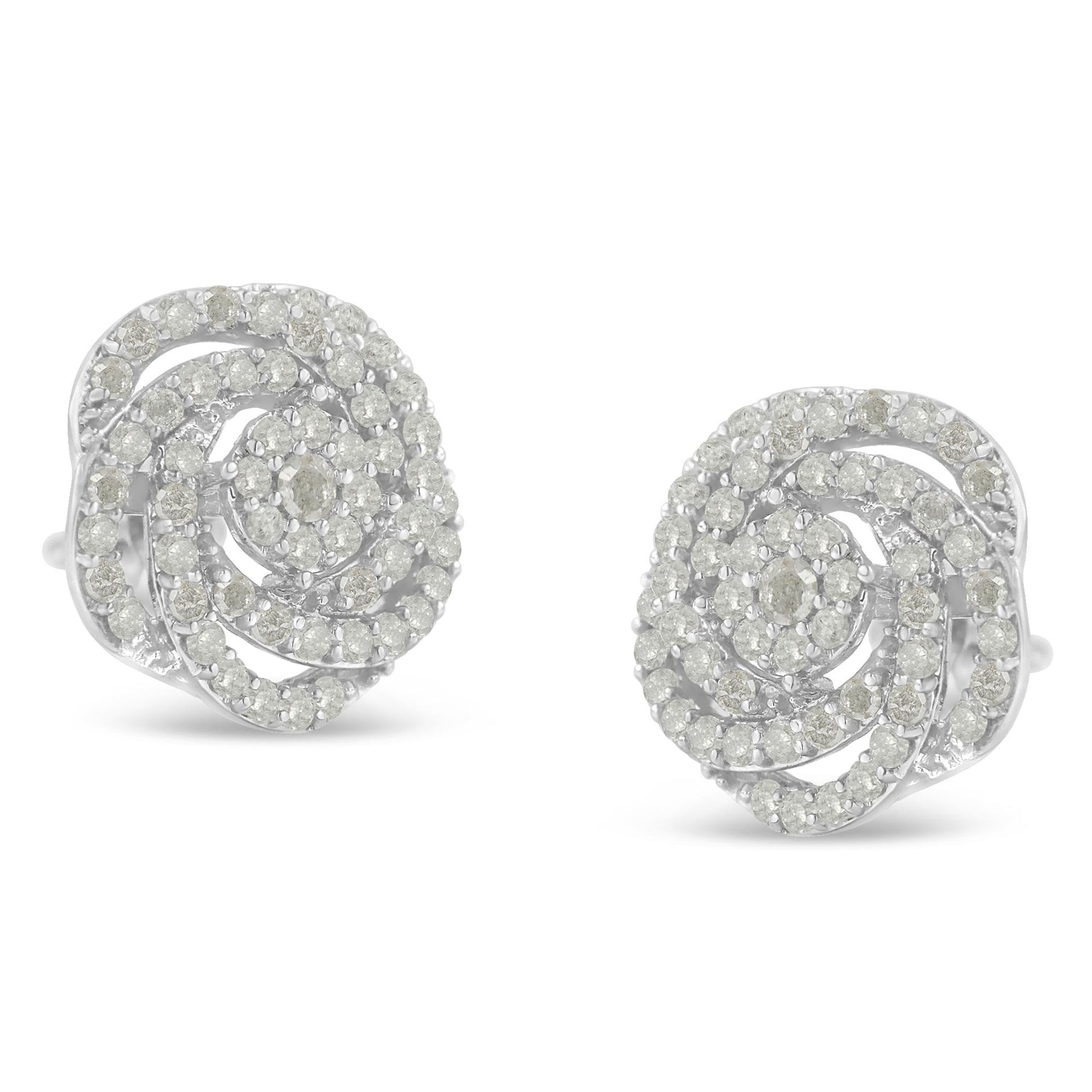 Pair of white metal earrings with round white gemstones arranged in a spiral pattern, shown from a front angled view.