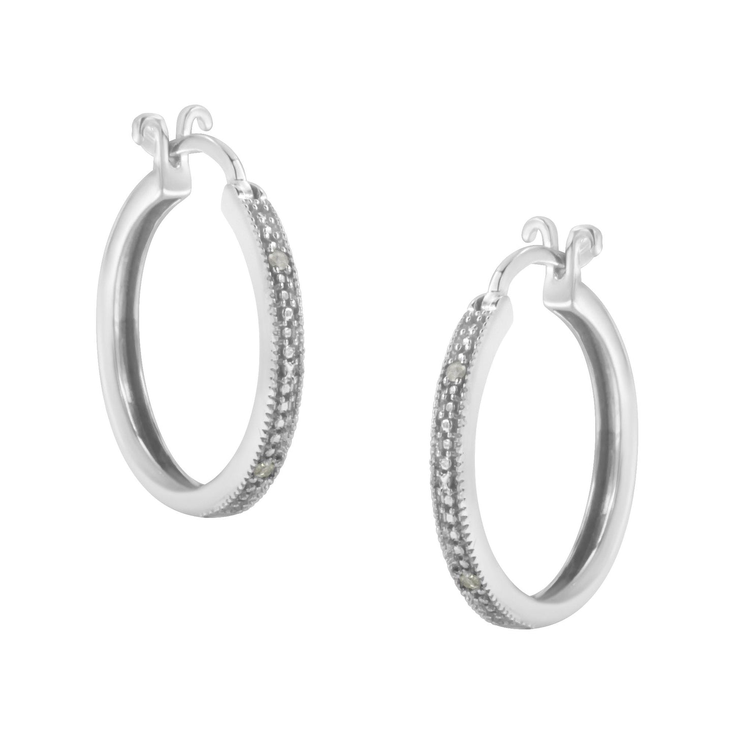 Pair of white metal hoop earrings with round white gemstones in pave setting along the outer edge, shown at a slight angle.