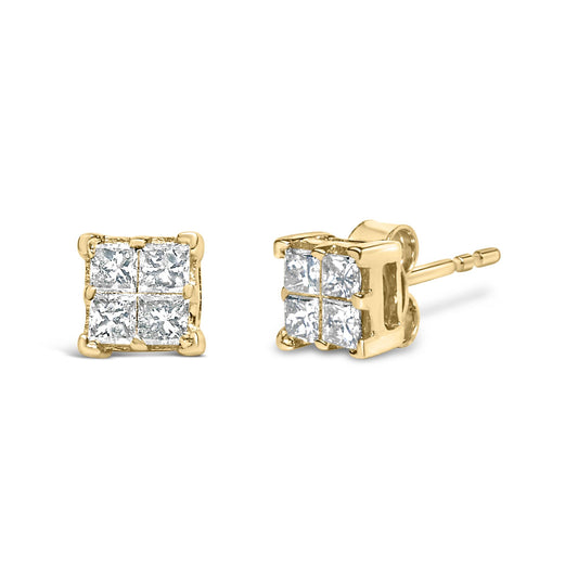 Pair of yellow metal stud earrings with four princess-shaped white gemstones in invisible setting, shown at a slight angle.