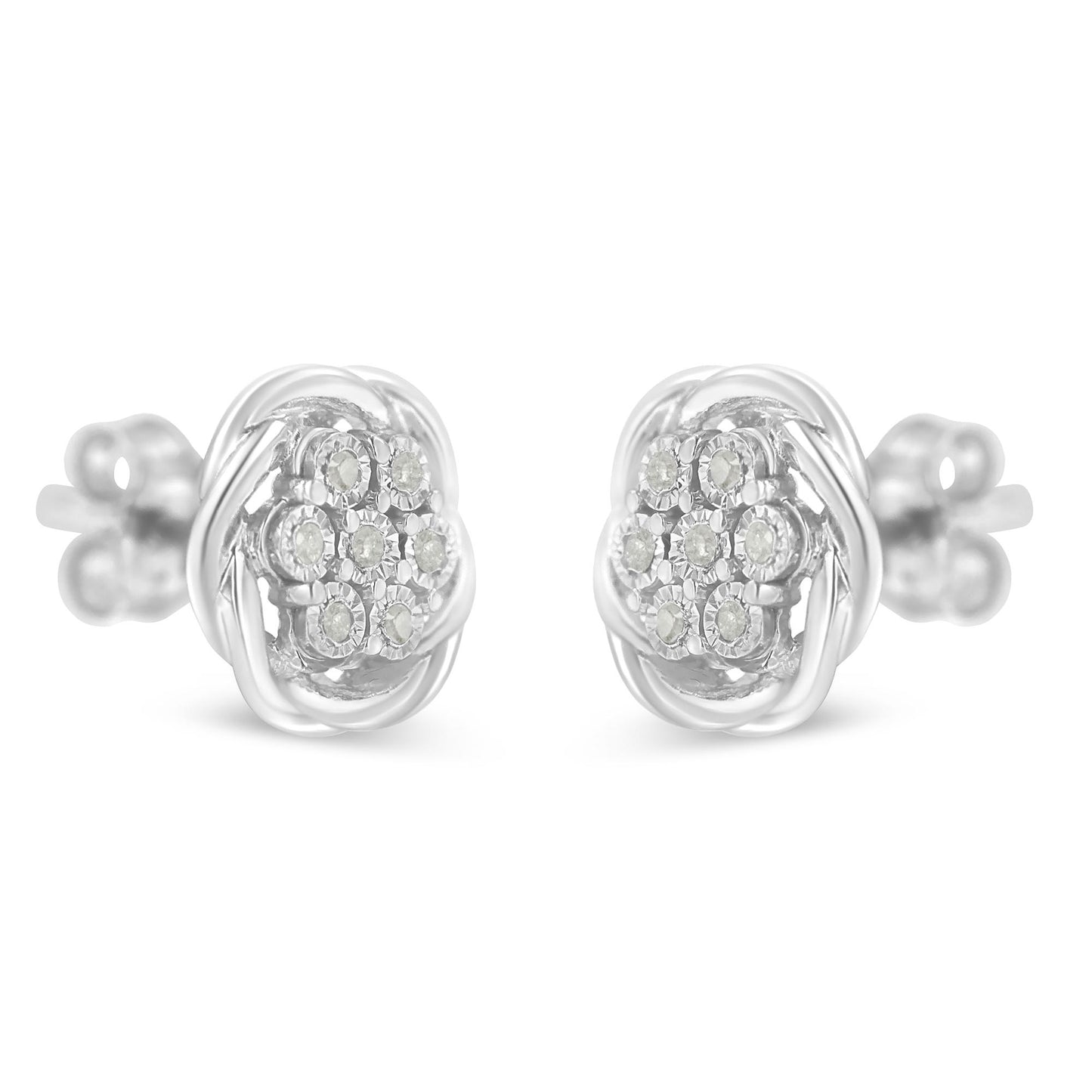 Front-facing close-up of a pair of white metal stud earrings with round white gemstones in a cluster setting.
