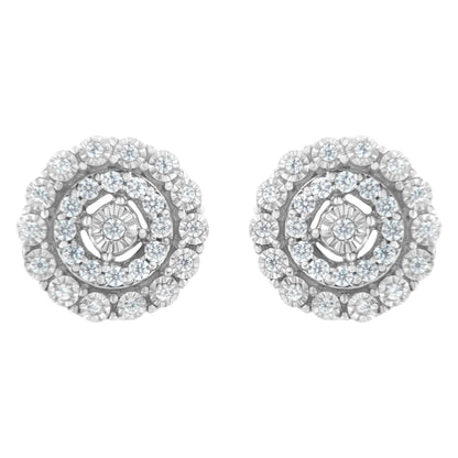 Front view of a pair of round white metal earrings with multiple small white gemstones in a pave setting arranged in concentric circles.