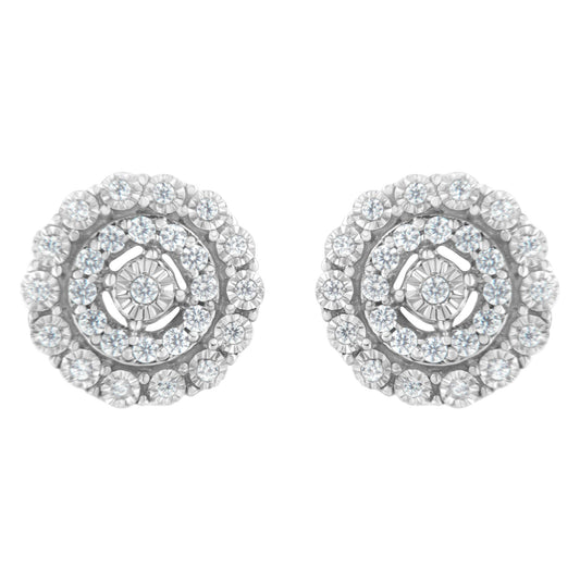 Front view of a pair of round white metal earrings with multiple small white gemstones in a pave setting arranged in concentric circles.