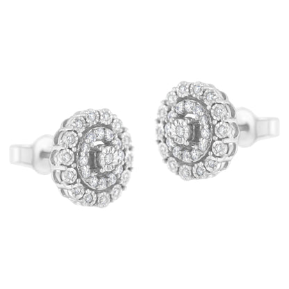 Pair of white metal round stud earrings with multiple white gemstones in a pave setting, shown from a front angle.
