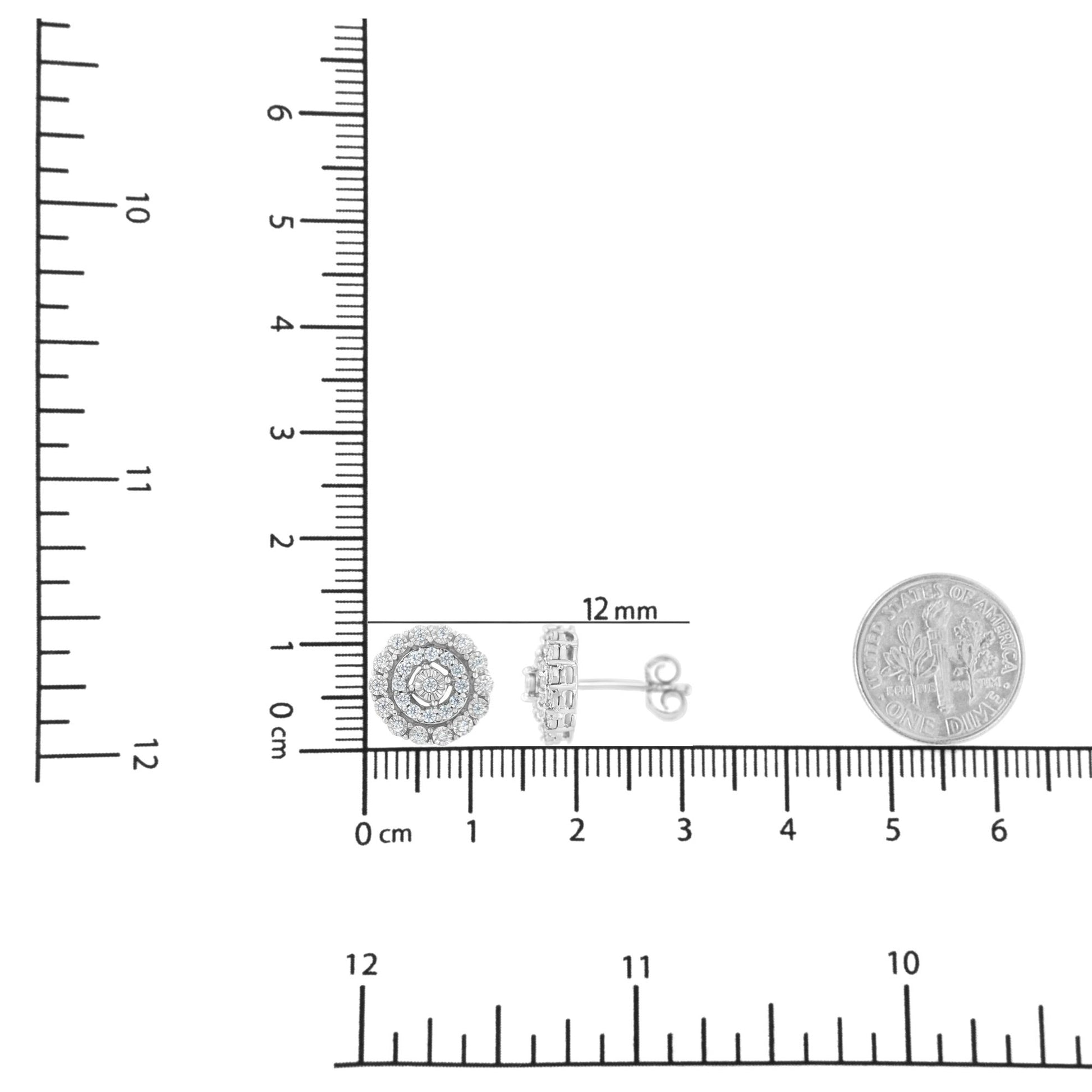 White metal round-shaped pave set white gemstone earrings shown from front and side angles on a ruler for size reference.