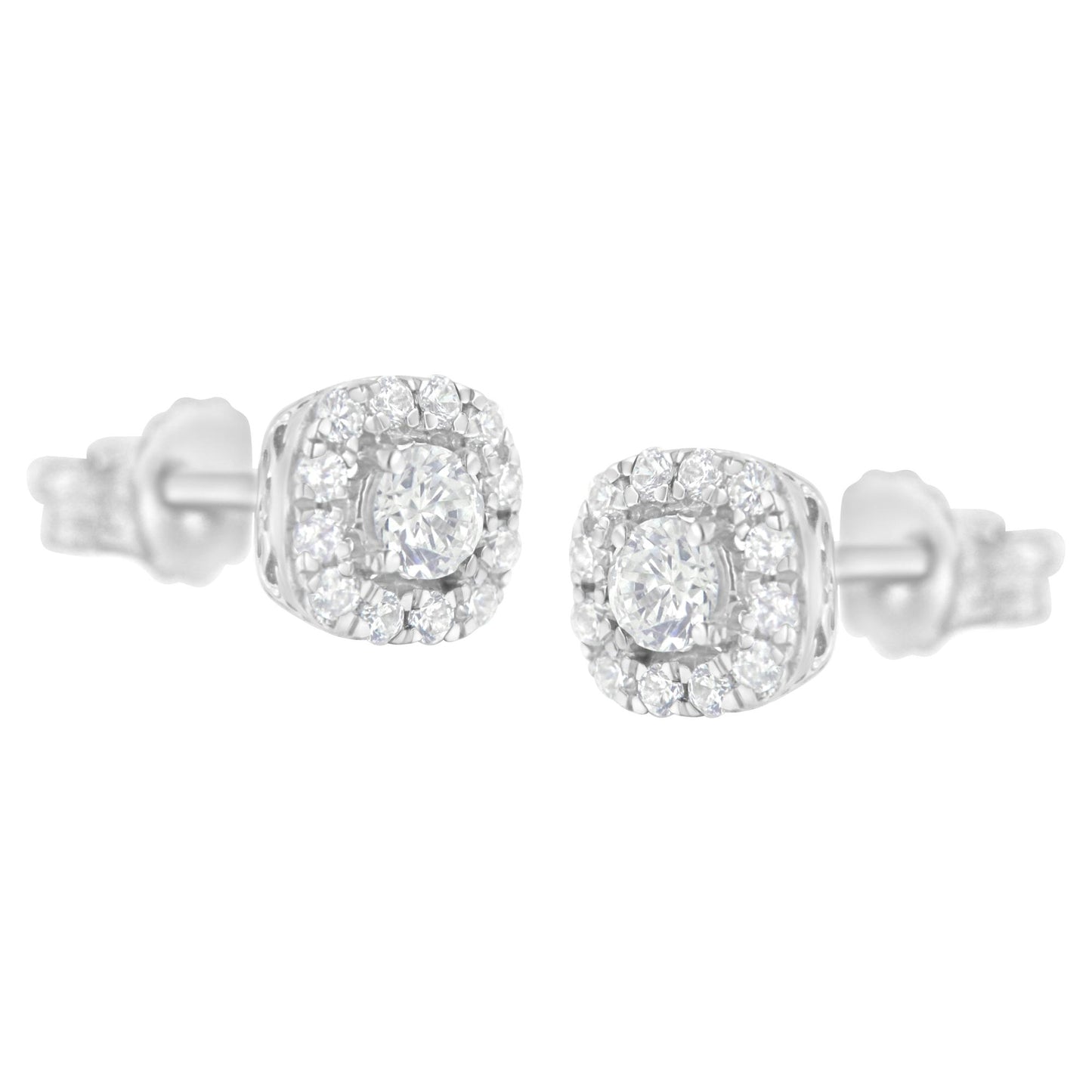 Pair of white metal stud earrings with round white gemstones in four-prong and pave settings, shown from a front angle.