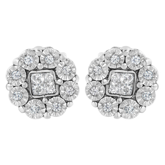 Close-up front view of a pair of white metal stud earrings featuring clusters of round white gemstones surrounded by square white gemstones in the center.