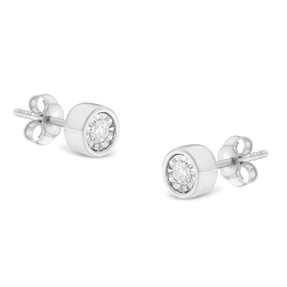 Pair of white metal stud earrings with round white gemstones in miracle settings, shown in a close-up angled view.