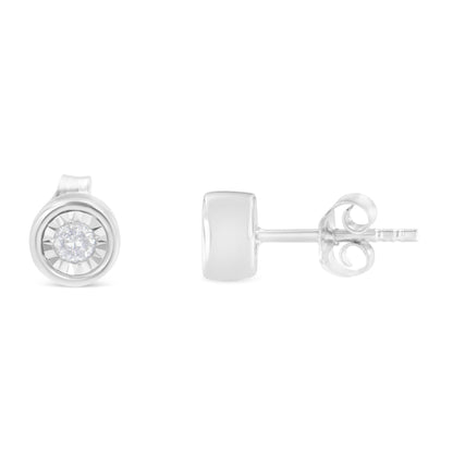 Front and side view of white metal stud earrings with round white gemstones in miracle setting, isolated on white background.
