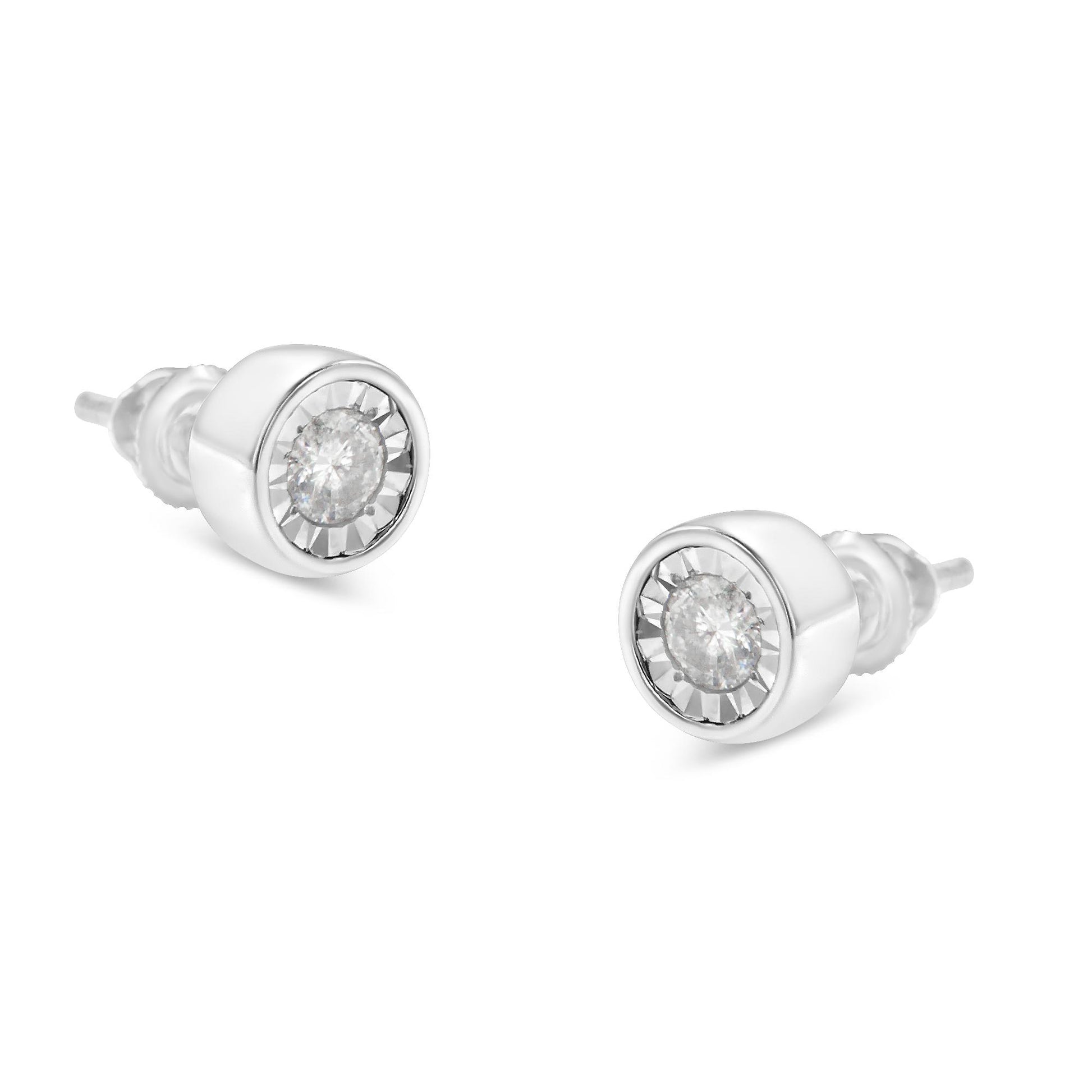 Pair of white metal stud earrings with round white gemstones set in a miracle setting, shown at a slight angle on a white background.