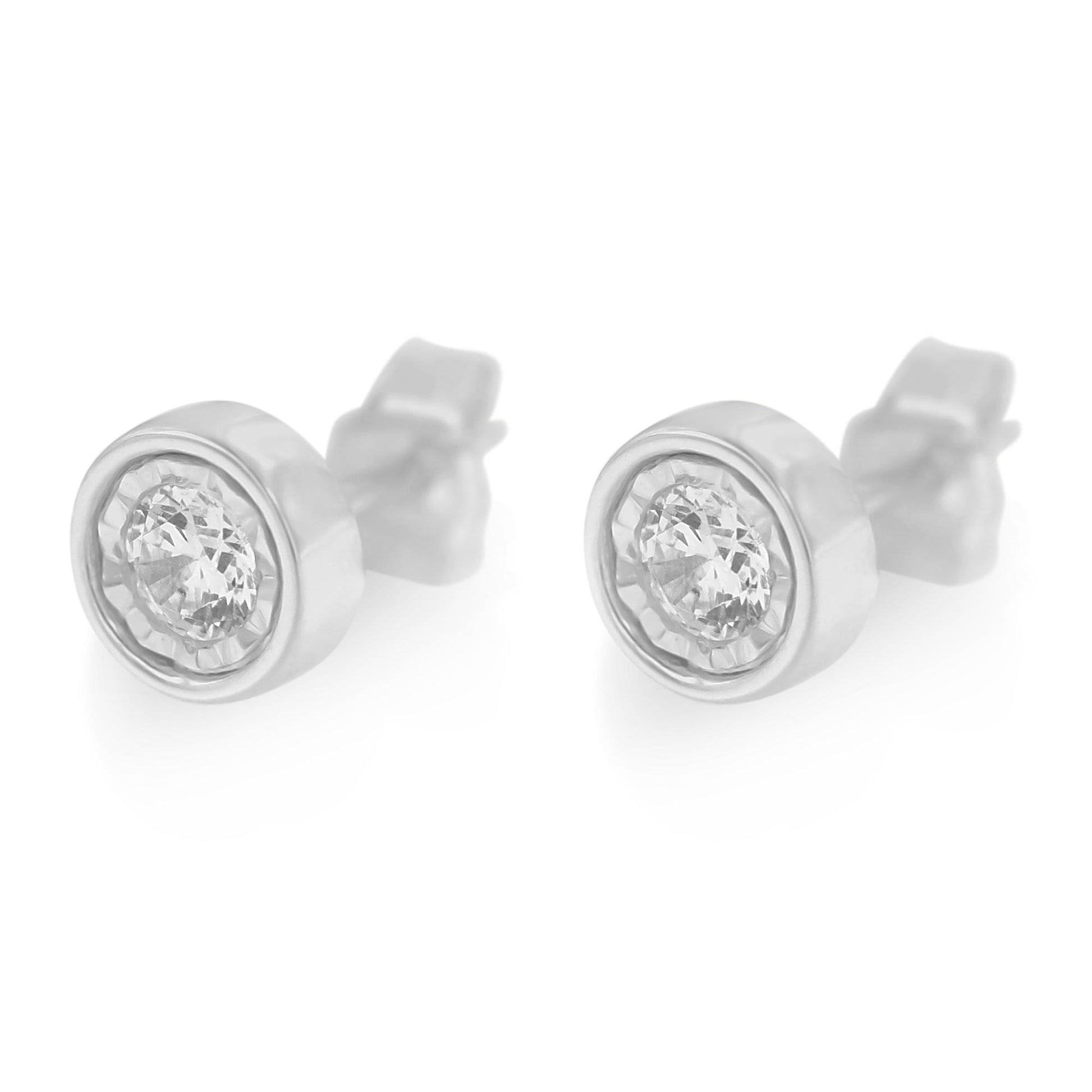 Pair of white metal round stud earrings with central round white gemstones in miracle setting, front angle.