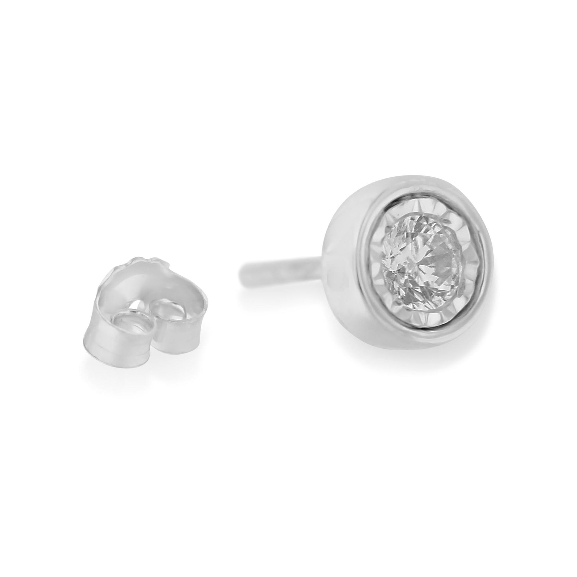 Close-up front angle of a single white metal stud earring with a round white gemstone in a miracle setting, alongside its butterfly backing.