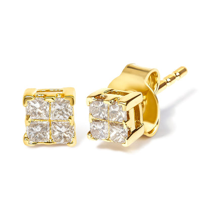 Pair of yellow metal stud earrings with clusters of white princess-shaped gemstones in an angled close-up shot.