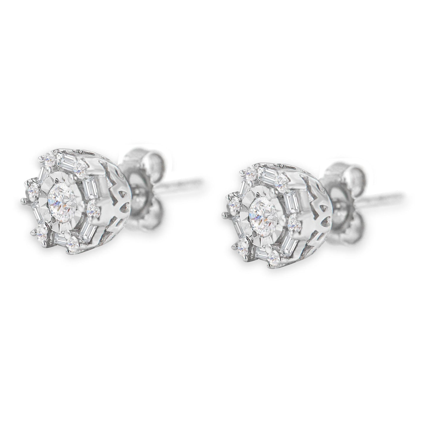 Pair of white metal stud earrings with round and baguette white gemstones in various settings, shown from a side angle.