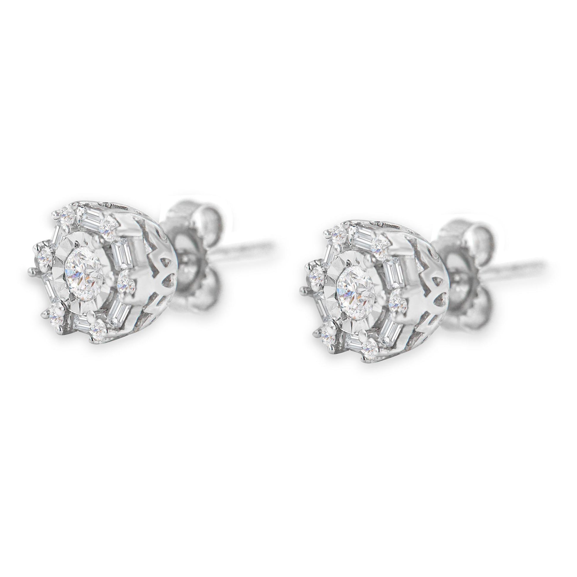 Pair of white metal stud earrings with round and baguette white gemstones in various settings, shown from a side angle.