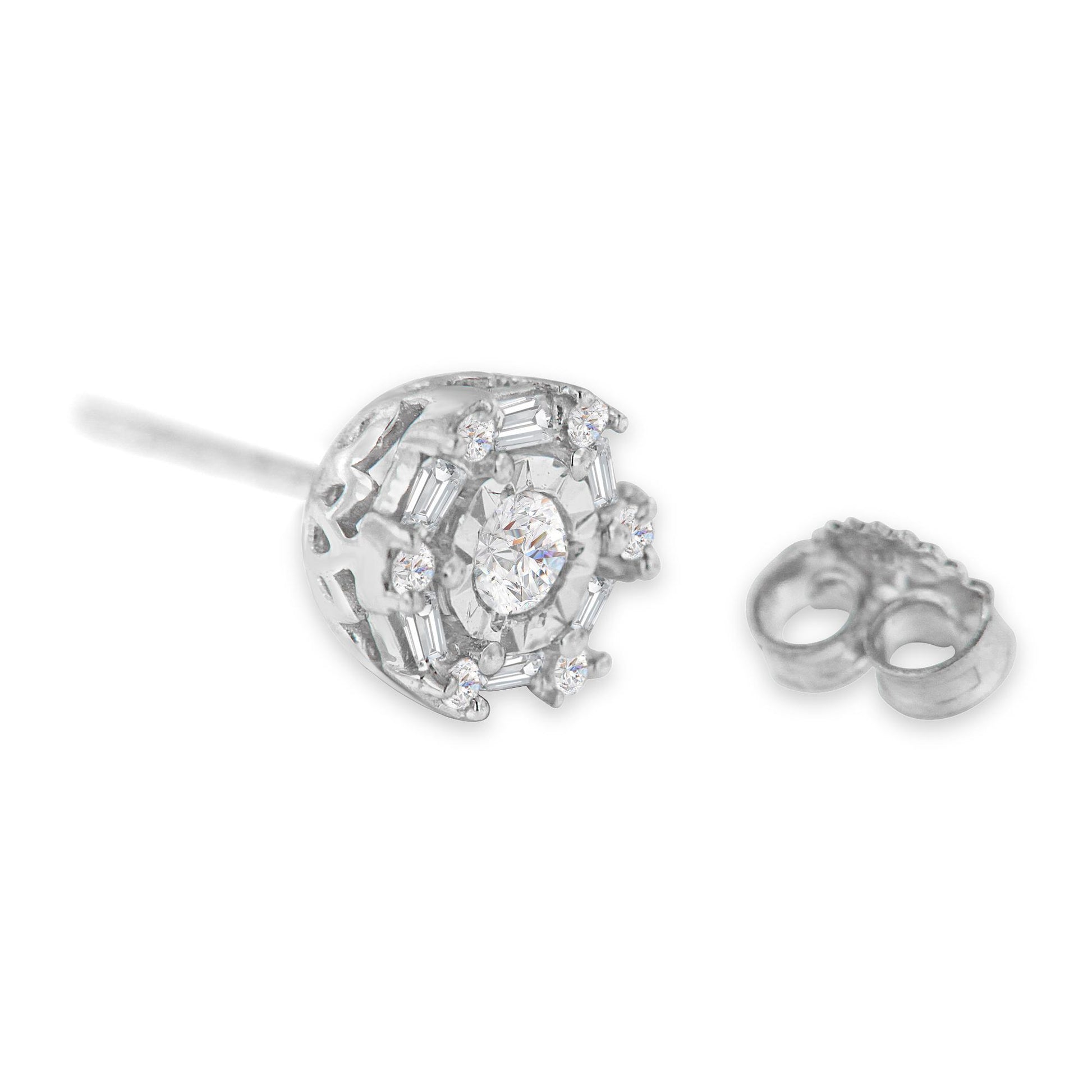 Close-up front angle of a white metal stud earring with a central round gemstone in invisible setting, surrounded by round and baguette-shaped white gemstones in miracle and channel settings, with a separate earring backing next to it.