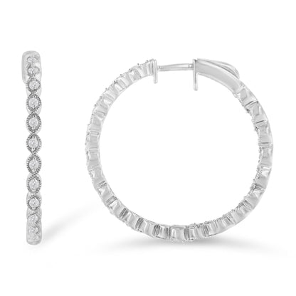 Close-up front and side views of white metal hoop earrings with round white gemstones in prong settings along the outer edges.