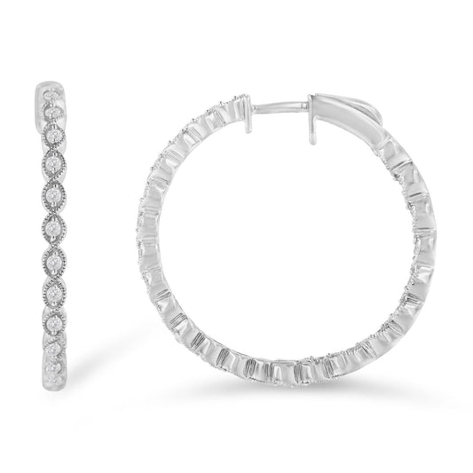 Close-up front and side views of white metal hoop earrings with round white gemstones in prong settings along the outer edges.