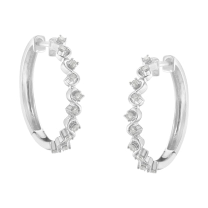 Pair of white metal hoop earrings with round white gemstones in prong settings along the outer edge, shown from a front angle.