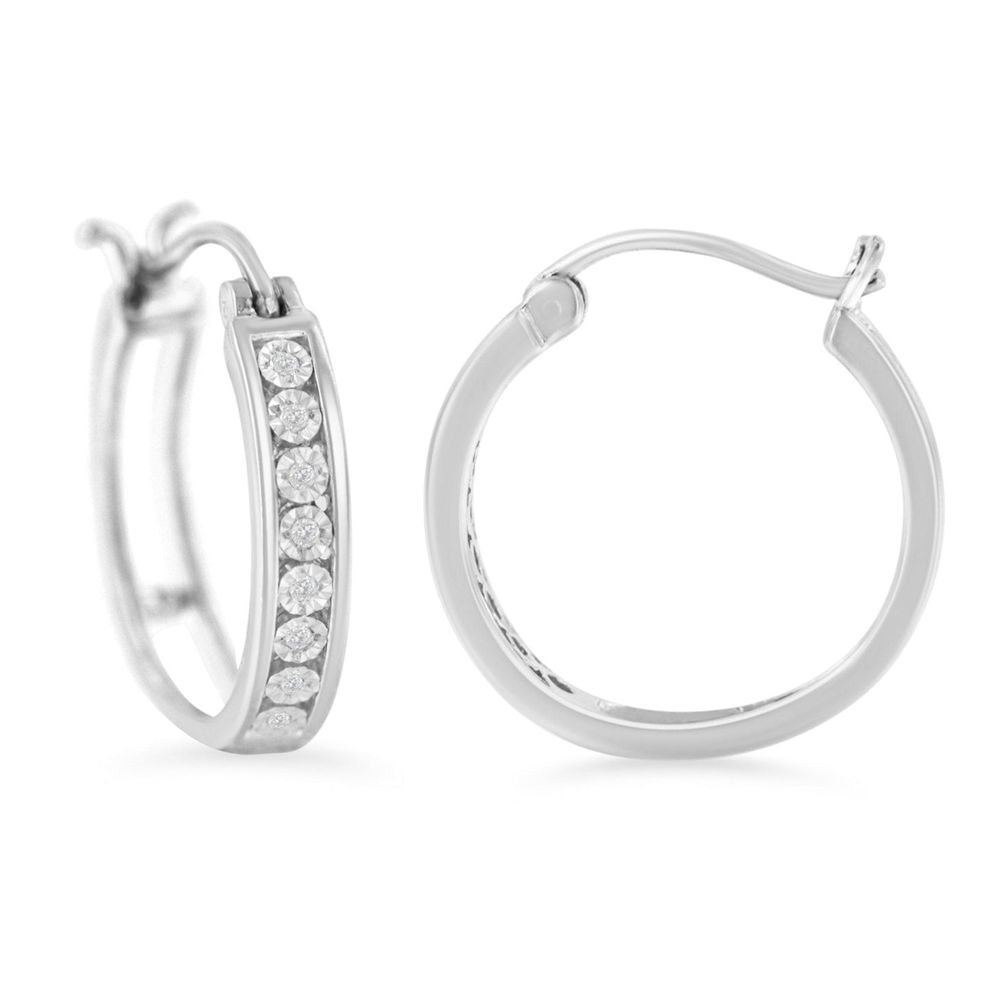 Pair of white metal hoop earrings, one shown front-facing with white round gemstones set along the front, the other shown from the side; image captured against a white background.