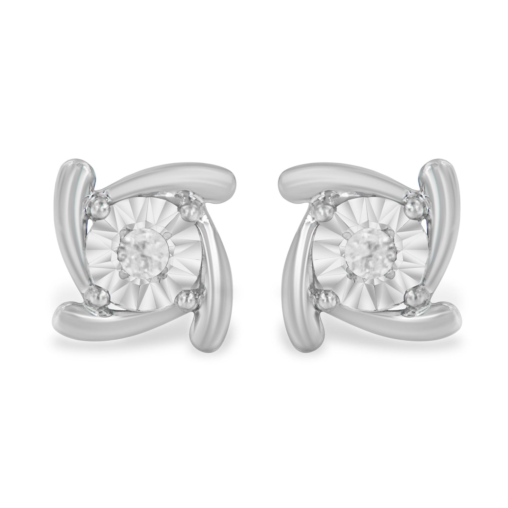 Front view of a pair of white metal stud earrings with a round white gemstone in the center held by miracle setting accents.