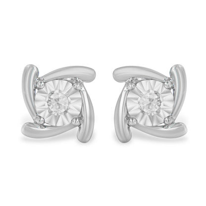 Front view of a pair of white metal stud earrings with a round white gemstone in the center held by miracle setting accents.
