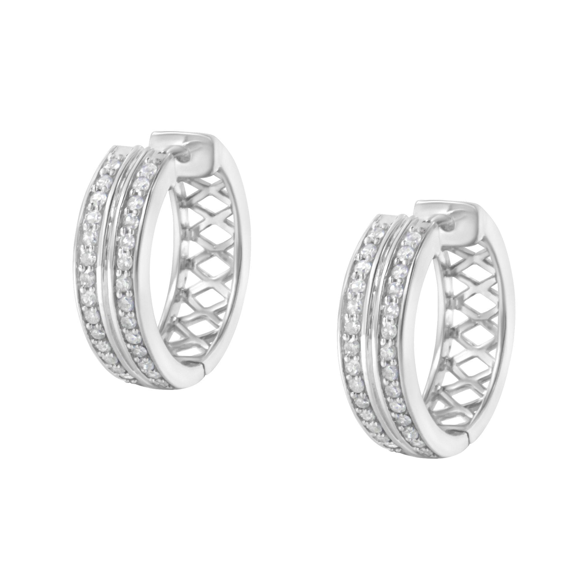 Pair of white metal hoop earrings with two rows of small white gemstones in pave setting, shown from a slightly angled front view.