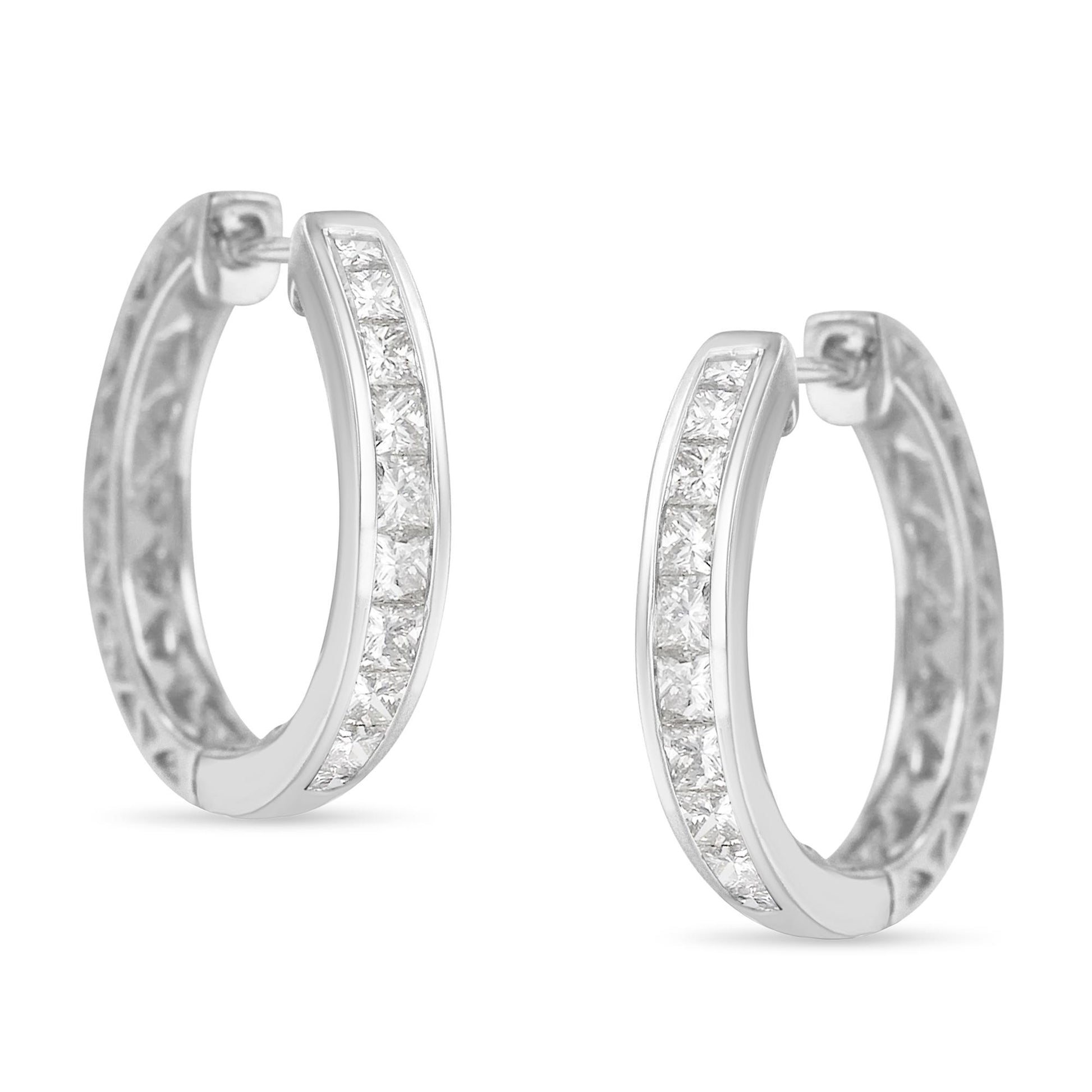 Pair of white metal hoop earrings with channel-set white princess-shaped gemstones, shown from a front angle on a white background.