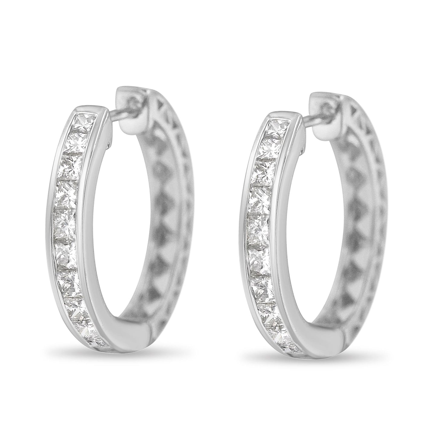 Pair of white metal hoop earrings with channel-set white princess shape gemstones, shown from a front perspective.