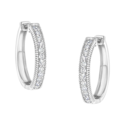 Pair of white metal hoop earrings with two rows of small round white gemstones in prong settings, shown from front angle.