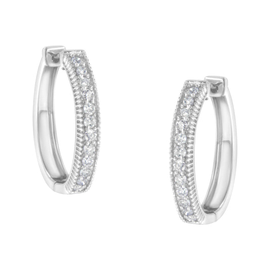Pair of white metal hoop earrings with two rows of small round white gemstones in prong settings, shown from front angle.