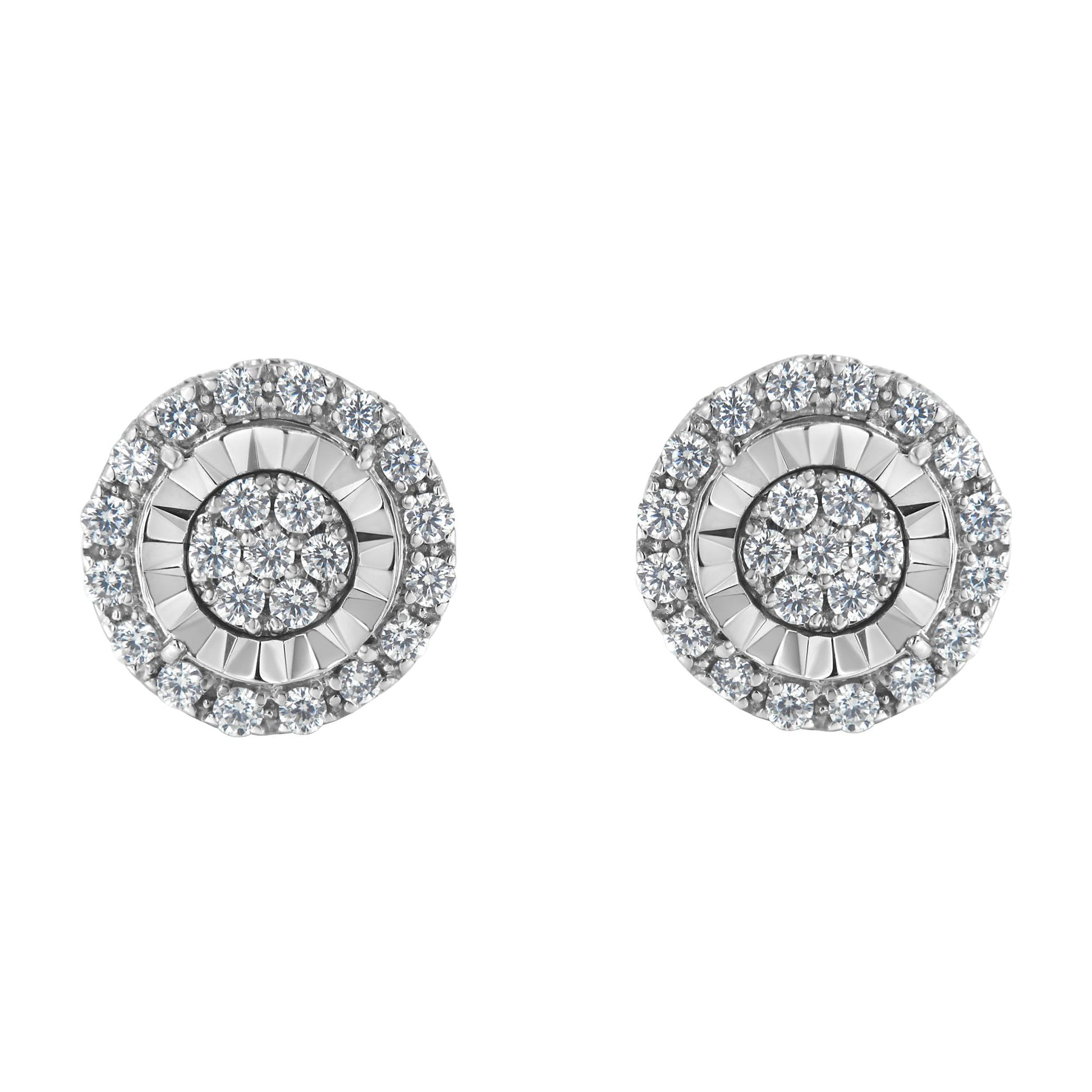 Front angle view of a pair of round white metal earrings with concentric circles of prong-set white gemstones.