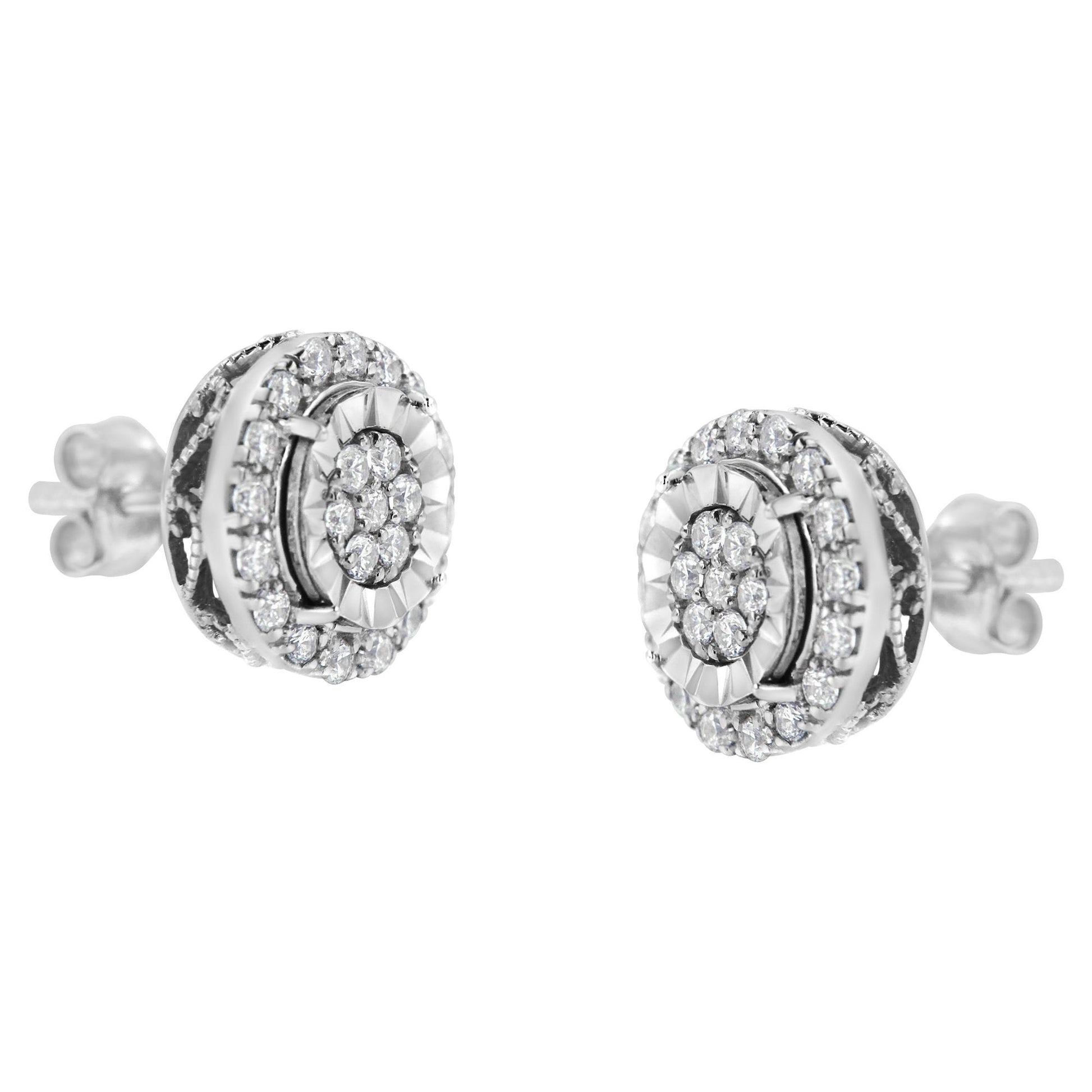 Pair of white metal stud earrings with round white gemstones in prong settings, shown from a front angled view.