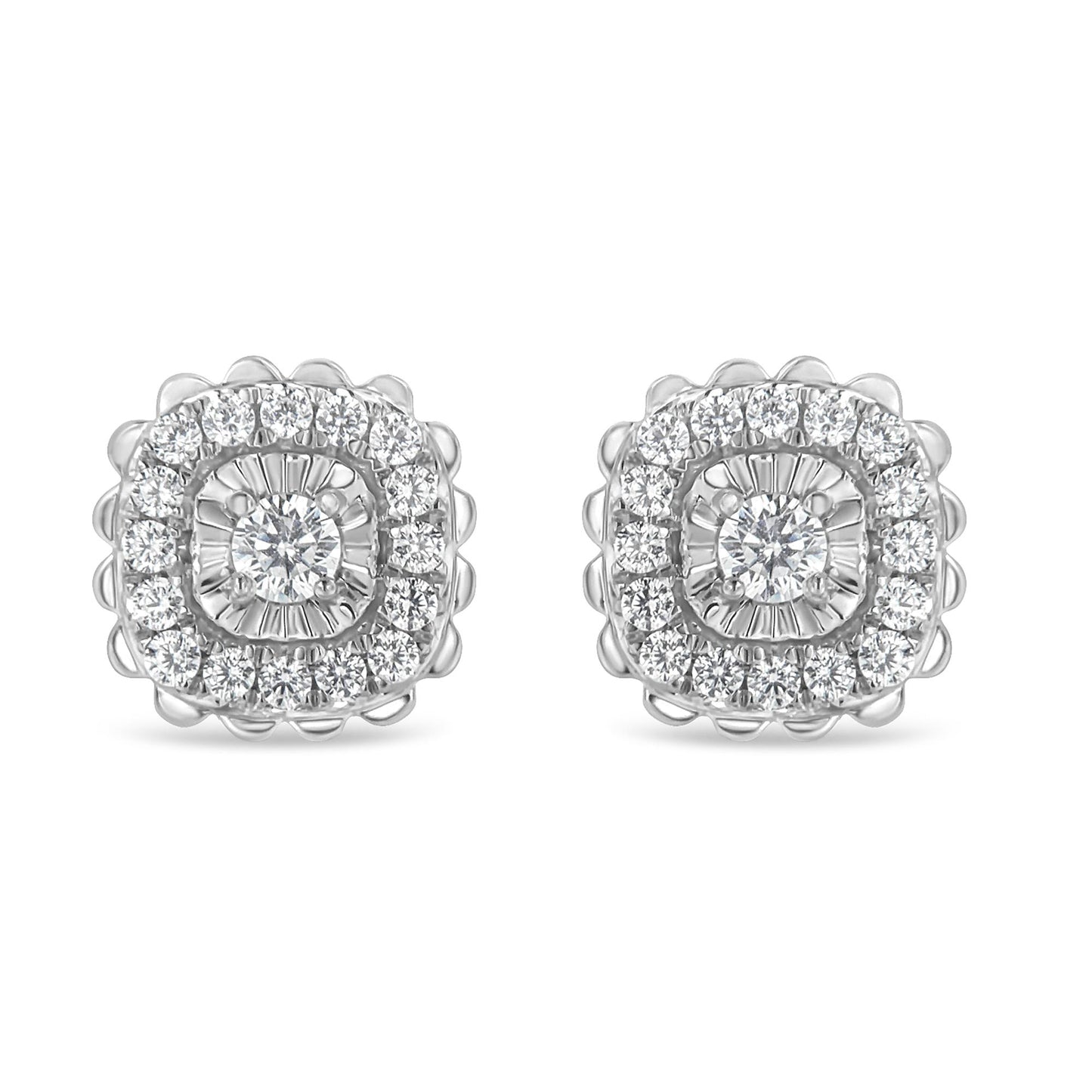 Front view of white metal stud earrings featuring a central round white gemstone in prong setting surrounded by two rows of round white gemstones, the inner row in miracle setting and the outer row in prong setting.